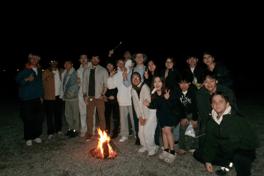 The SOON team gathered around a campfire